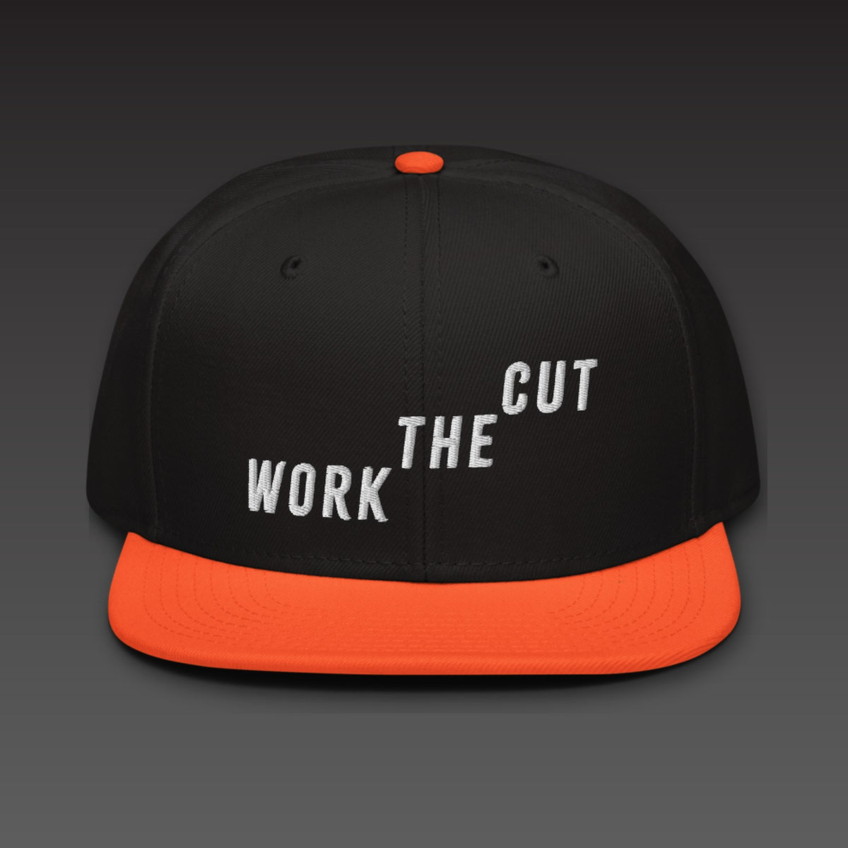 Climb Flat Bill in orange visor, WORK THE CUT climbing across the front in white embroidery