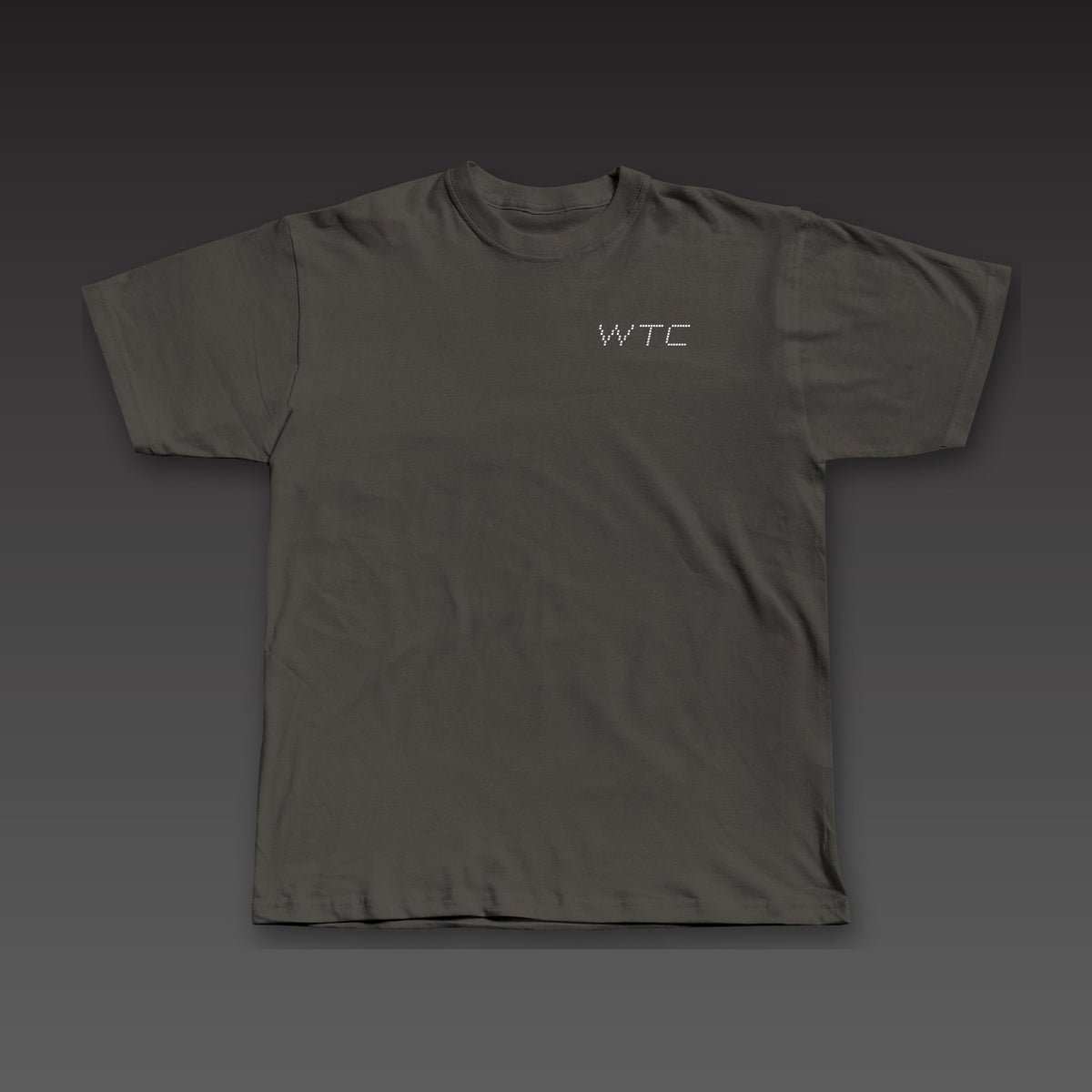 Split Decision Tee in charcoal black, dotted Work the Cut stacked on the left chest