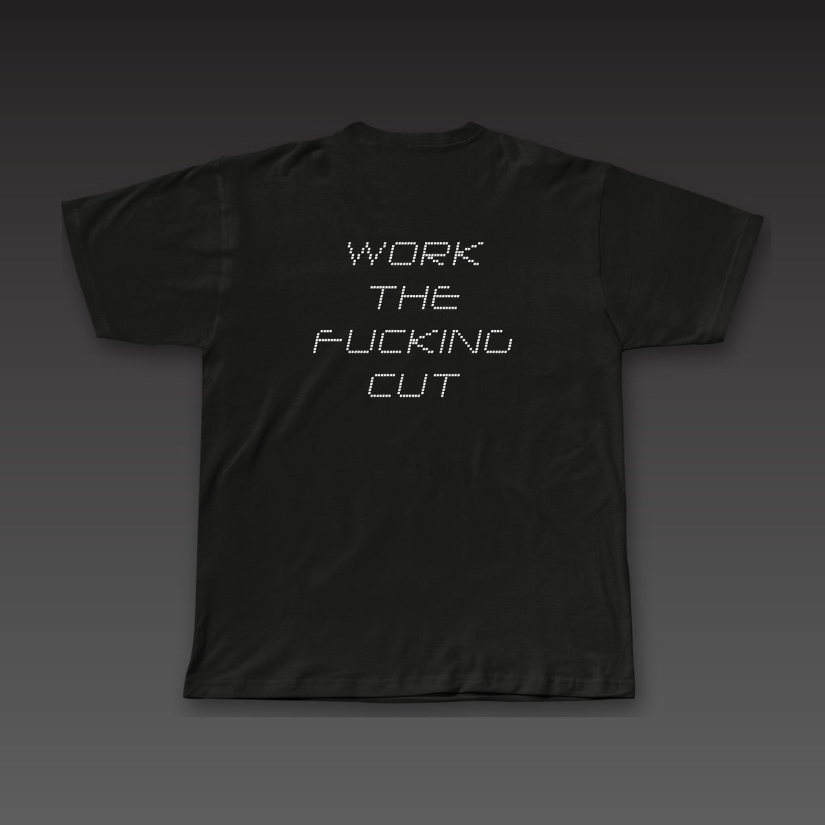 Scorecard Tee in black, the full phrase stacked in dotted letters across the back