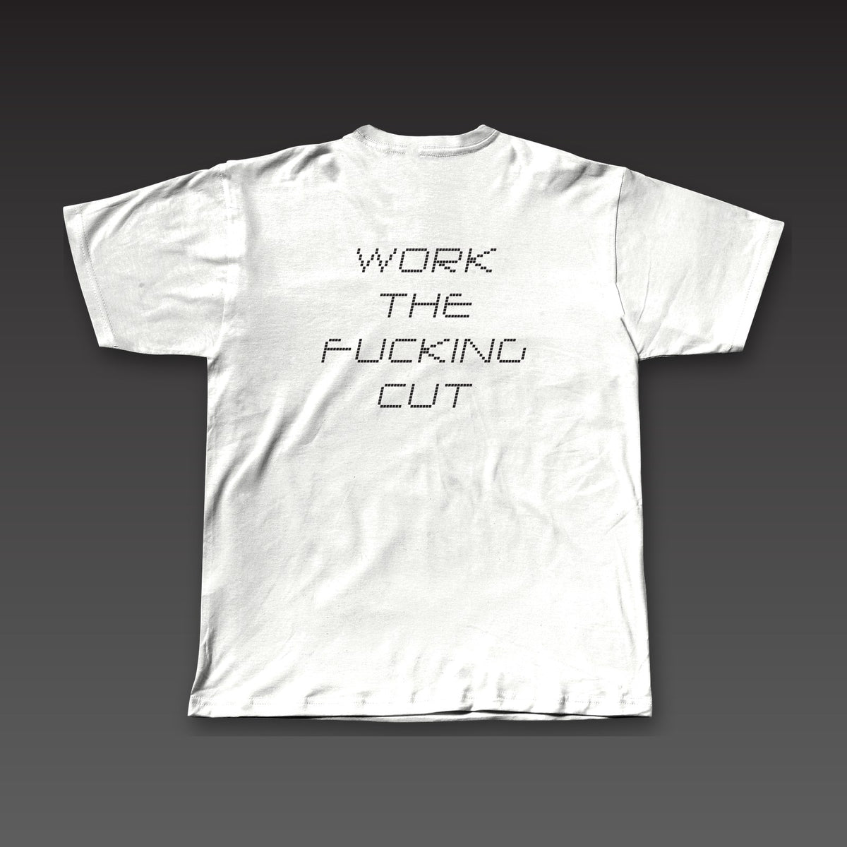 Scorecard Tee in white, the full phrase stacked in dotted letters across the back