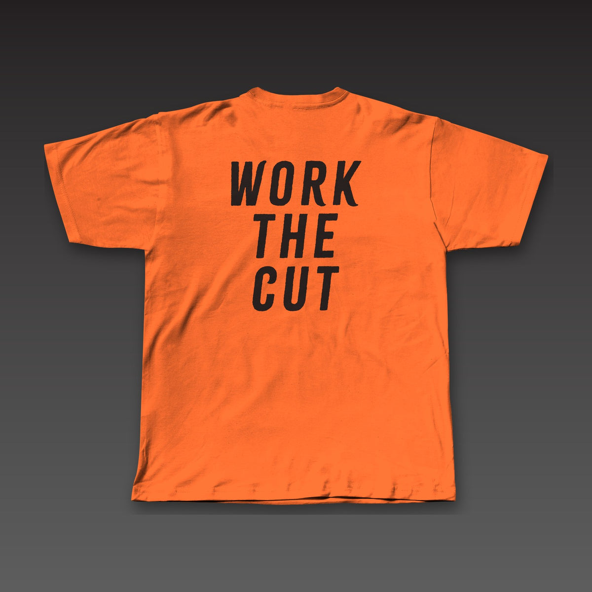 The Jab Tee in orange, Work the Cut stacked across the back
