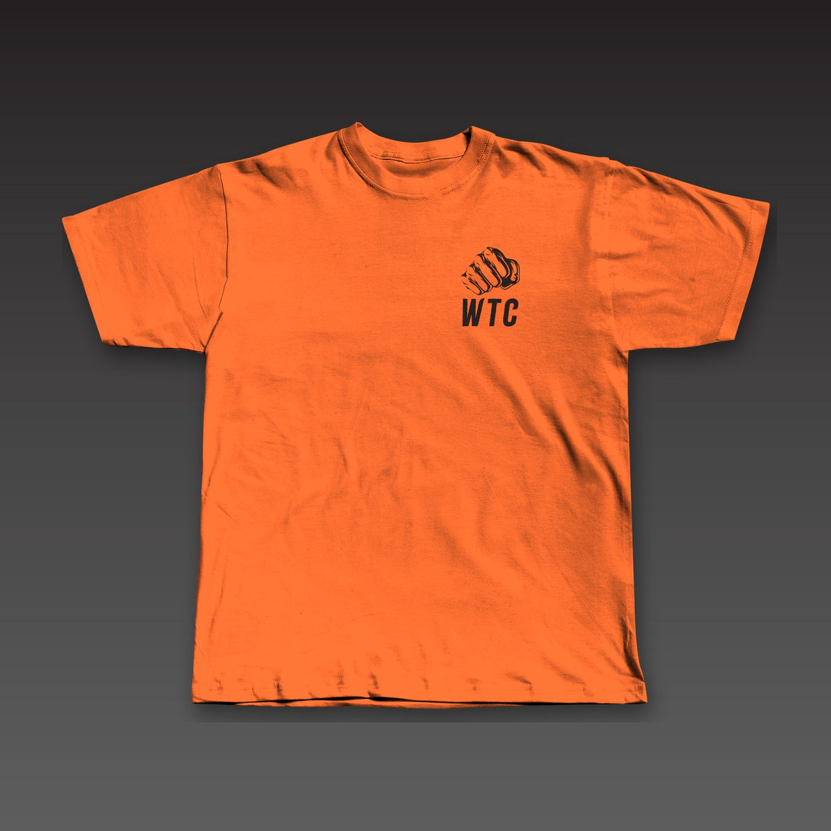 The Jab Tee in orange, a fist over WTC on the left chest