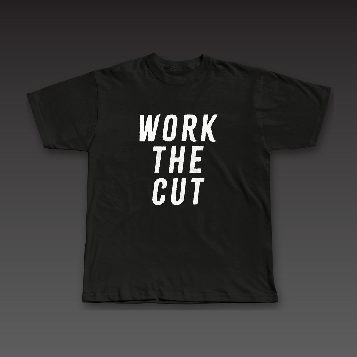 Headliner Tee in black, Work the Cut stacked down the whole front