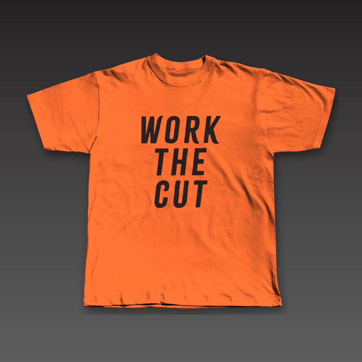Headliner Tee in orange, Work the Cut stacked down the whole front