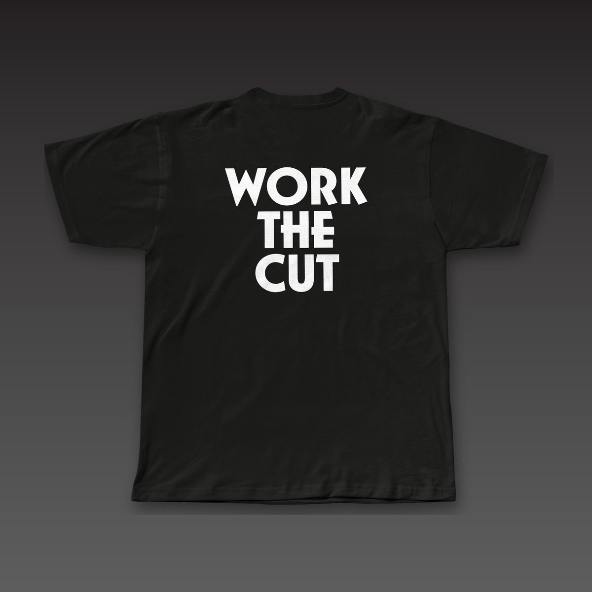 Heavyweight Tee in black, Work the Cut stacked in geometric letters across the back