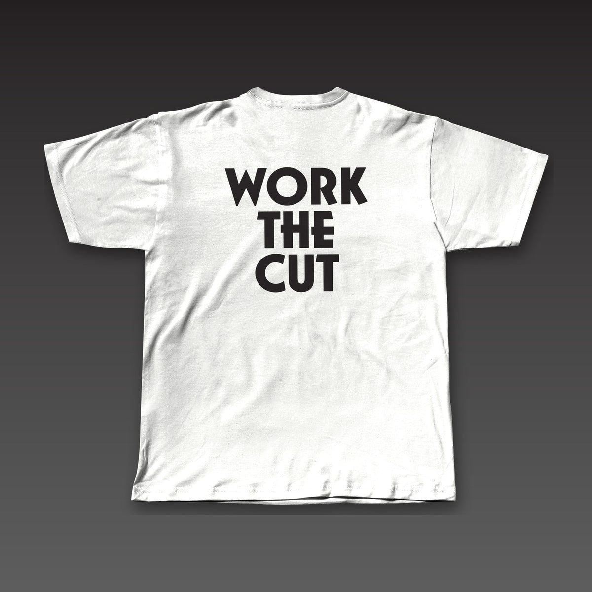 Heavyweight Tee in white, Work the Cut stacked in geometric letters across the back