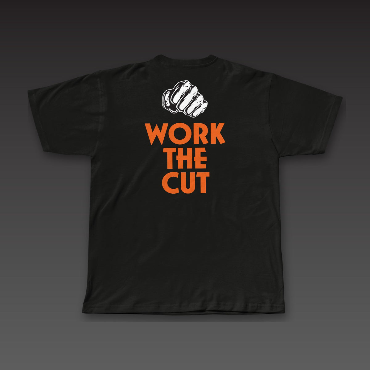 OG Tee in black / orange, a fist over Work the Cut stacked across the back
