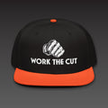 OG Fist Flat Bill in orange visor, the fist over WORK THE CUT in white type, printed on the front