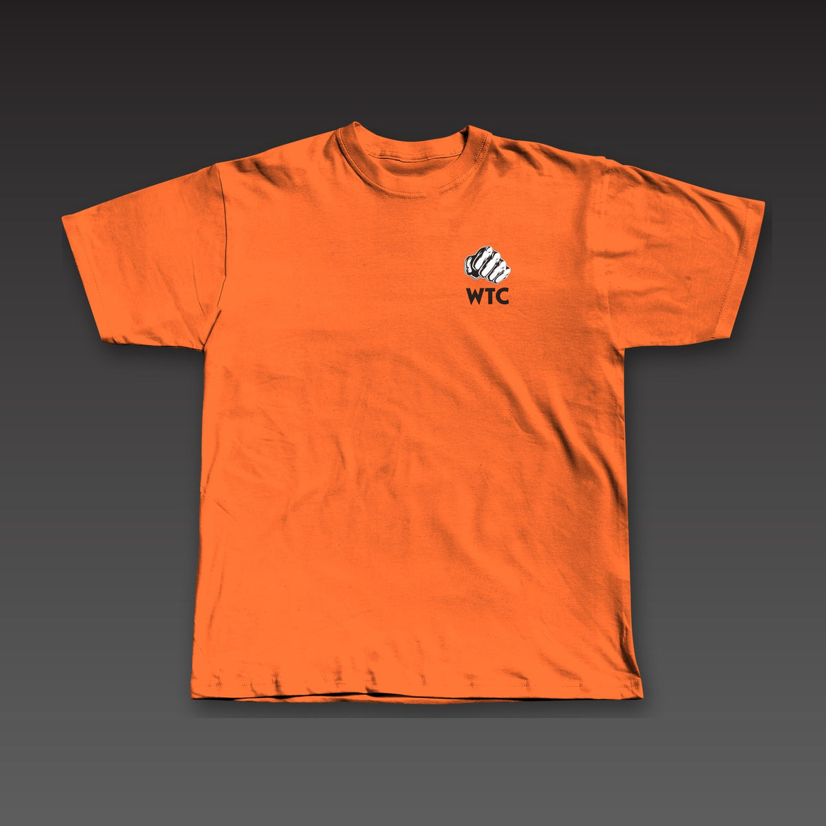 OG Tee in orange, a fist over WTC on the left chest