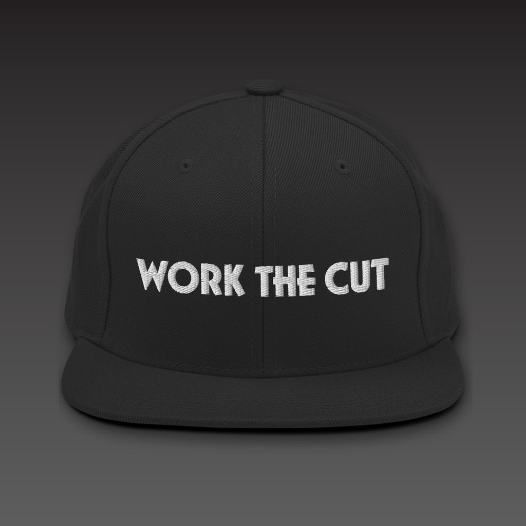 One-Line Flat Bill in black / white, WORK THE CUT in one line of white embroidery across the front