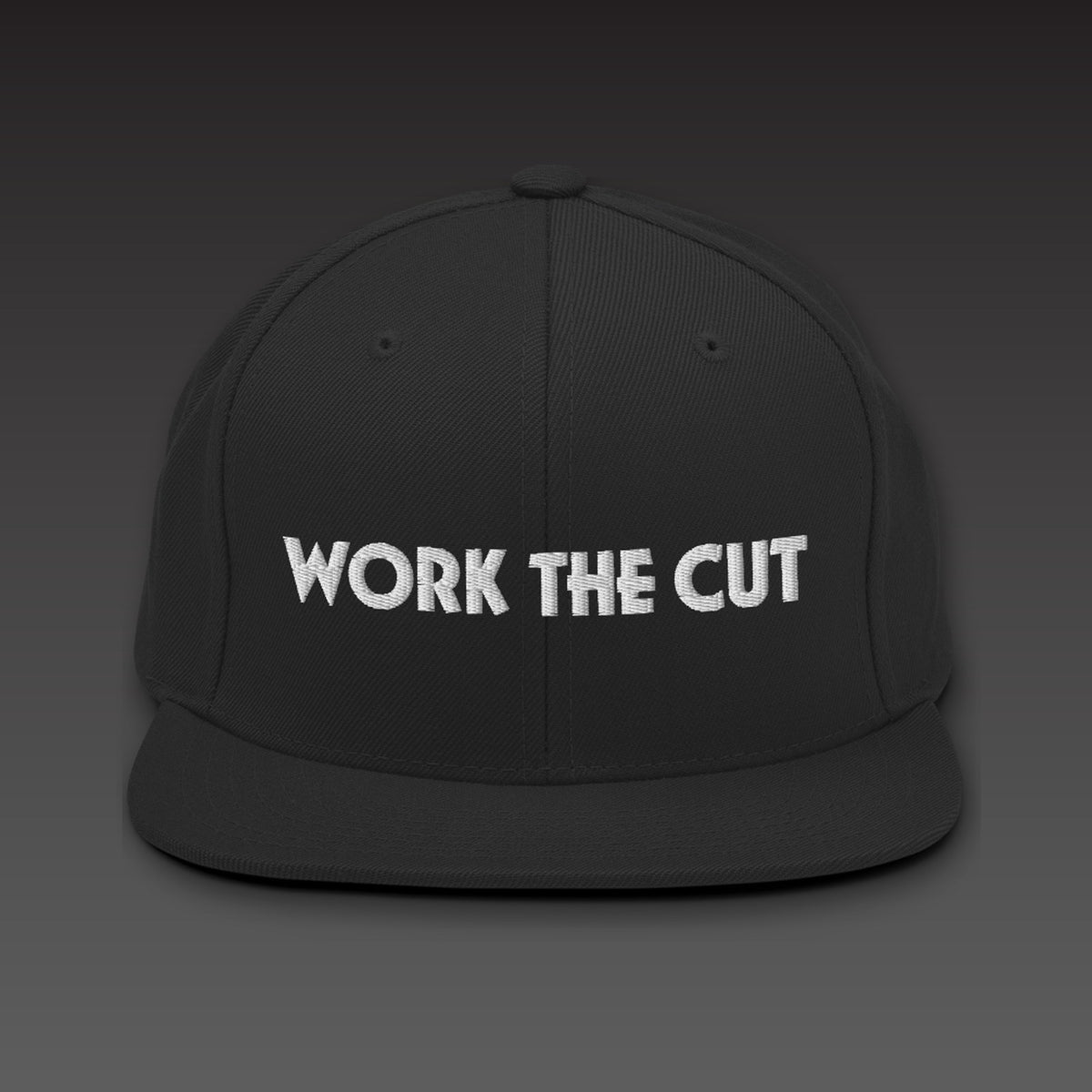 One-Line Flat Bill in black / white, WORK THE CUT in one line of white embroidery across the front