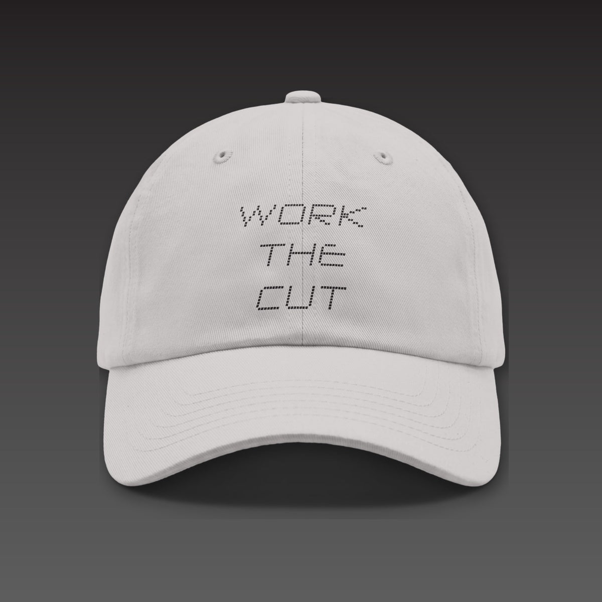 Scoreboard Dad Cap in light grey, WORK THE CUT stacked in black scoreboard dots on the front