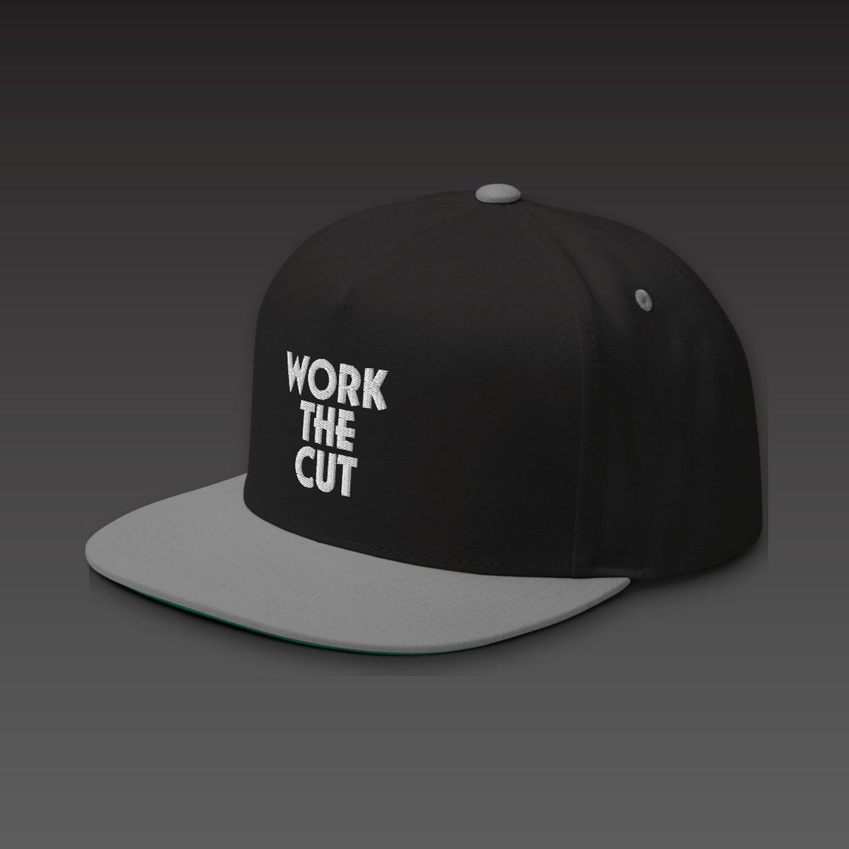 Stack Five-Panel in grey visor, WORK THE CUT stacked in white embroidery on the front, seen from the side