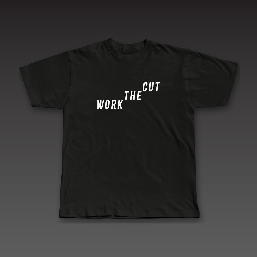 Late Rounds Tee in black, Work the Cut climbing up across the chest