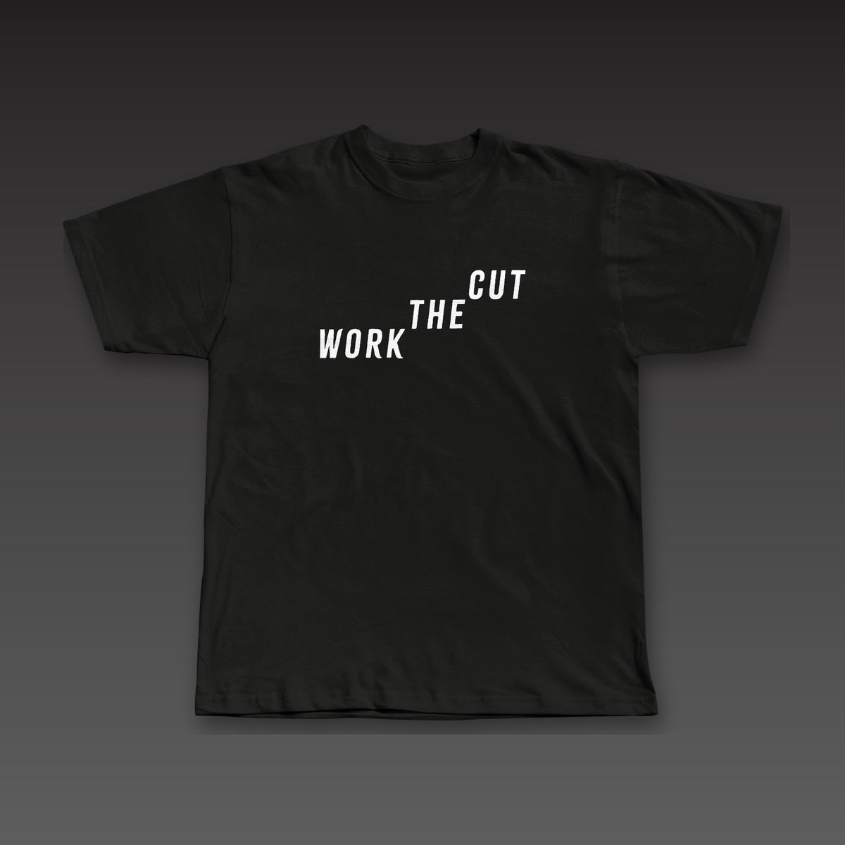 Late Rounds Tee in black, Work the Cut climbing up across the chest
