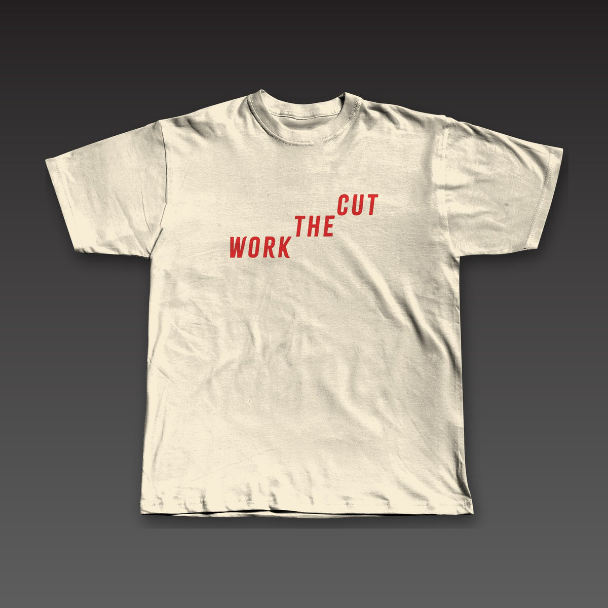 Late Rounds Tee in oatmeal / red, Work the Cut climbing up across the chest