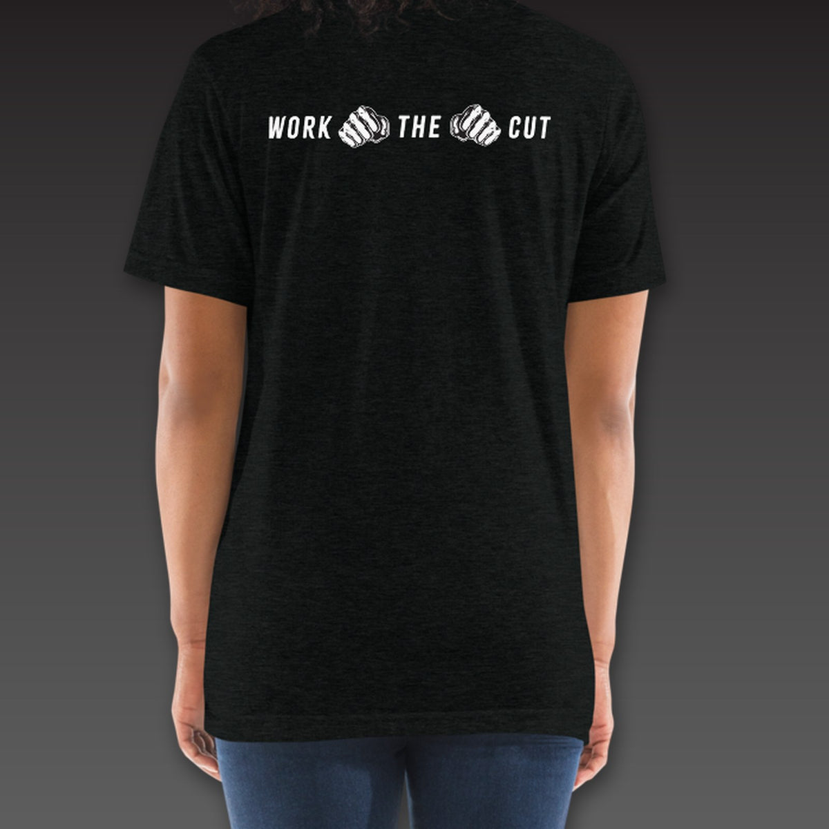 Women's One-Two Tee in black, Work the Cut in a row with fists below the collar