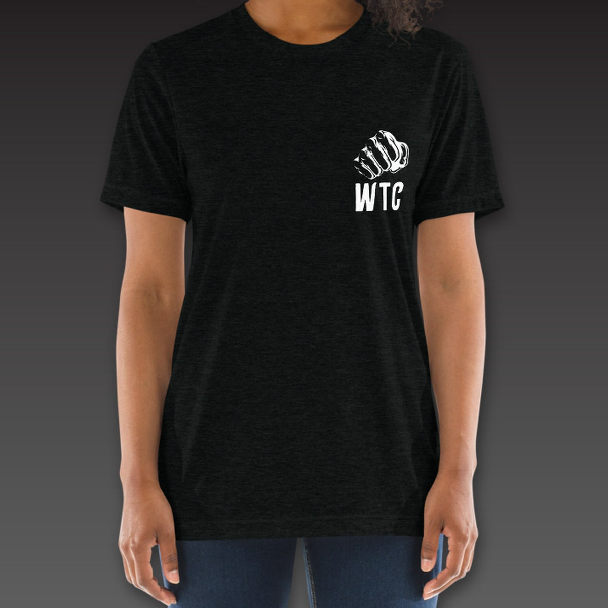Women's Jab Tee in black, a fist over WTC on the left chest