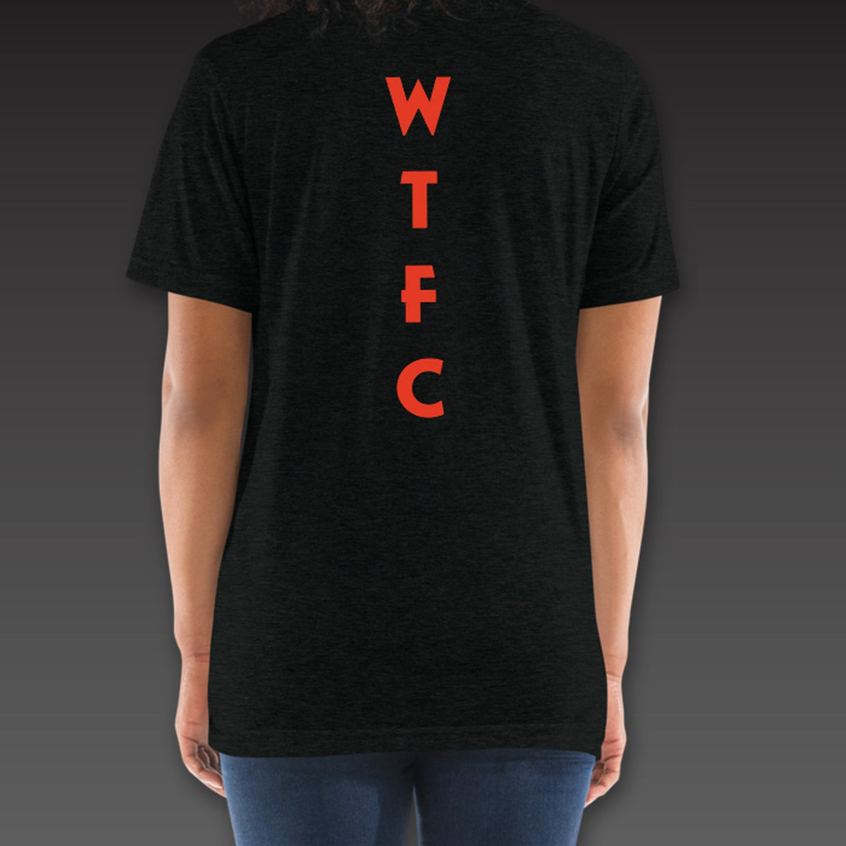 Women's Uppercut Tee in black / blood orange, geometric WTFC running down the spine