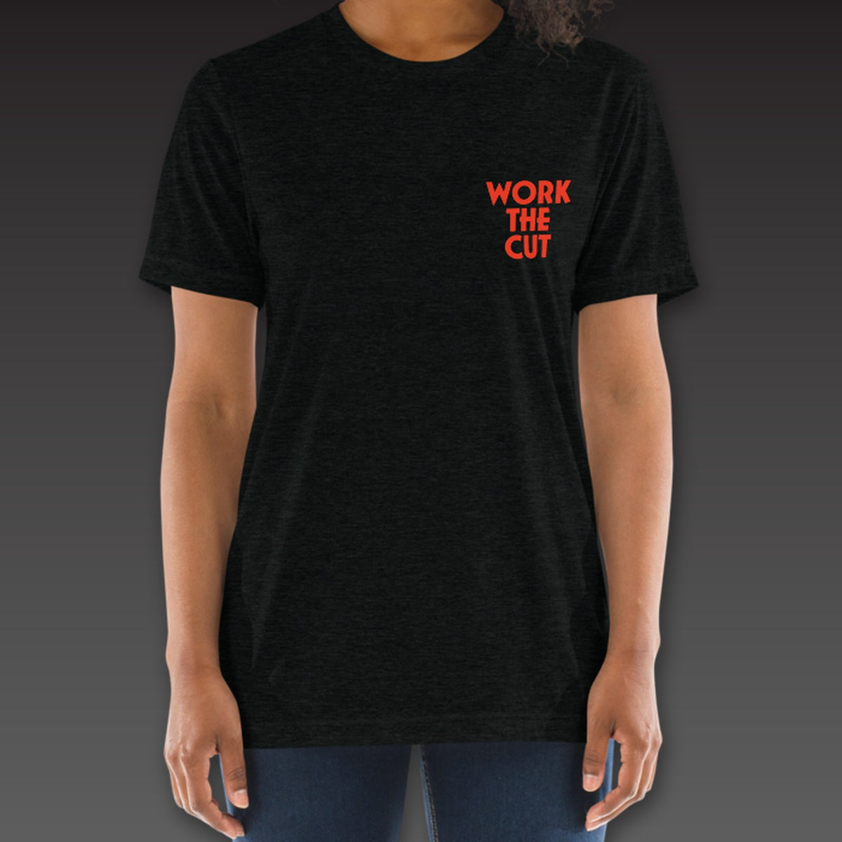 Women's Uppercut Tee in black / blood orange, geometric Work the Cut stacked on the left chest