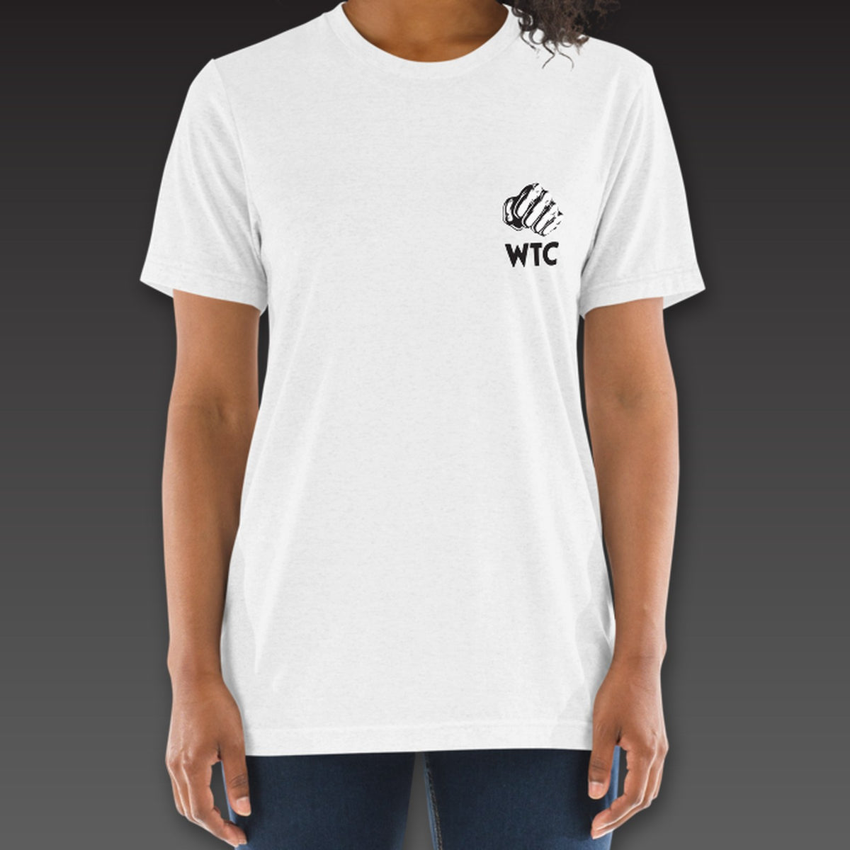 Women's OG Tee in white, a fist over WTC on the left chest